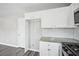 White cabinets and subway tile create a clean, modern kitchen design at 1147 Saint Phillips Ct, Locust Grove, GA 30248