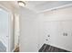 Bright laundry room with wood-look floors and easy access at 1147 Saint Phillips Ct, Locust Grove, GA 30248