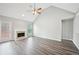 Spacious living room featuring vaulted ceilings, a fireplace, and modern laminate flooring at 1147 Saint Phillips Ct, Locust Grove, GA 30248