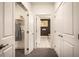 Hallway view showcasing storage options and leading to a bathroom, blending style and functionality at 3351 Orwell Way # 2304, Cumming, GA 30041