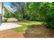 Well-maintained backyard with lush greenery and a concrete patio at 3684 Clearbrooke Way, Duluth, GA 30097