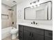 Modern bathroom featuring a shower-tub combo, square mirror, and a sleek gray vanity with white countertop at 3684 Clearbrooke Way, Duluth, GA 30097