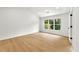 This is a bedroom with natural light, wooden floors, and white walls at 3684 Clearbrooke Way, Duluth, GA 30097