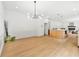 Open concept dining area featuring contemporary lighting and seamless flow into the living spaces at 3684 Clearbrooke Way, Duluth, GA 30097