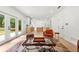 Bright, open-concept living area with access to kitchen, outdoor view and contemporary decor at 3684 Clearbrooke Way, Duluth, GA 30097