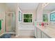 Bright bathroom featuring a shower, soaking tub, and vanity with a view of the trees at 4161 Magnolia Glen Walk, Norcross, GA 30093