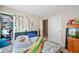 Cozy bedroom with a comfortable bed, closet, and fish tank creating a serene atmosphere at 4161 Magnolia Glen Walk, Norcross, GA 30093