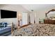 Spacious bedroom featuring a TV, two closets and an ensuite bathroom, maximizing space at 4161 Magnolia Glen Walk, Norcross, GA 30093