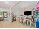Open concept dining room with wood floors, bright chandelier, and an open floorplan at 4161 Magnolia Glen Walk, Norcross, GA 30093