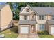 Charming two-story home with a one car garage and a well maintained lawn at 4161 Magnolia Glen Walk, Norcross, GA 30093