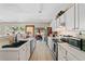 Bright and spacious kitchen with stainless appliances, white cabinets and hardwood floors at 4161 Magnolia Glen Walk, Norcross, GA 30093