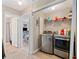 Modern laundry area with stainless steel washer and dryer next to bedroom at 4161 Magnolia Glen Walk, Norcross, GA 30093