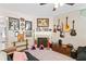 Comfortable living room area featuring a fireplace, fan, and unique wall decor at 4161 Magnolia Glen Walk, Norcross, GA 30093