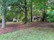Large, wooded backyard with small structure and green space for entertaining at 4323 Darwen Ct, Tucker, GA 30084