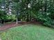 Lush green backyard featuring a wooded landscape and open green space at 4323 Darwen Ct, Tucker, GA 30084