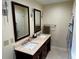 Bathroom featuring double sinks, tile floors, and updated fixtures at 4323 Darwen Ct, Tucker, GA 30084