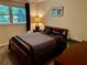 Cozy bedroom with warm neutral paint, carpeted floors, and large bright window at 4323 Darwen Ct, Tucker, GA 30084