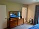 Spacious bedroom boasts neutral walls and an oversized mirror over a solid wood dresser at 4323 Darwen Ct, Tucker, GA 30084