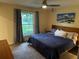 Cozy bedroom offers lots of natural light and features a ceiling fan for added comfort at 4323 Darwen Ct, Tucker, GA 30084