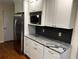Bright kitchen features granite countertops, modern stainless steel appliances, and ample cabinet space at 4323 Darwen Ct, Tucker, GA 30084