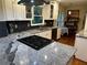 Updated kitchen featuring granite countertops, black backsplash, and stainless steel appliances at 4323 Darwen Ct, Tucker, GA 30084