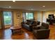 Bright living room features hardwood floors, comfortable seating, and a view of the well-maintained front yard at 4323 Darwen Ct, Tucker, GA 30084