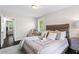 Bright bedroom featuring a comfortable bed, accent chair, and serene decor at 629 Dunton Se Cir, Smyrna, GA 30082