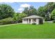 Charming single-story home featuring white siding, a well-manicured lawn, and a covered carport on a tree-lined street at 629 Dunton Se Cir, Smyrna, GA 30082