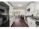 Updated kitchen featuring granite counters, stainless appliances, and open view to dining area at 629 Dunton Se Cir, Smyrna, GA 30082