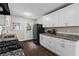 Well-lit kitchen with granite countertops, stainless steel appliances, and door to the backyard at 629 Dunton Se Cir, Smyrna, GA 30082