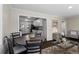 Inviting living room featuring stylish furnishings, neutral paint, and hardwood floors flowing to a modern kitchen at 629 Dunton Se Cir, Smyrna, GA 30082