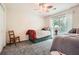 This cozy bedroom features two beds, plush carpet, natural lighting, and neutral colored walls at 750 Gates Ln, Alpharetta, GA 30022