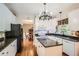 Bright kitchen with white cabinets, granite countertops, hardwood floors, and stainless steel appliances at 750 Gates Ln, Alpharetta, GA 30022