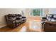 Cozy living room with hardwood floors, bay window, and comfortable seating with a neutral color palette at 750 Gates Ln, Alpharetta, GA 30022