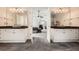 The main bathroom provides double sinks, granite countertops, and an entrance into the main bedroom at 750 Gates Ln, Alpharetta, GA 30022