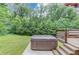 Backyard with a hot tub and a set of stairs leading up to it at 1148 Woodland Cir, Lawrenceville, GA 30043