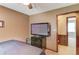 Bedroom with a dark bed set, a carpeted floor, and a view into another room at 1148 Woodland Cir, Lawrenceville, GA 30043