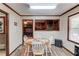 Dining area with seating for four and window to outdoor views at 1148 Woodland Cir, Lawrenceville, GA 30043