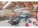 Garage with tools, lawn equipment and a white car inside at 1148 Woodland Cir, Lawrenceville, GA 30043