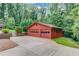 Exterior view of the additional, detached two car garage and extended driveway at 1148 Woodland Cir, Lawrenceville, GA 30043