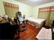 Cozy bedroom with wood floors, curtains, and natural light at 2480 Sewell Mill Rd, Marietta, GA 30062