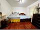 Simple bedroom with wood flooring and natural light at 2480 Sewell Mill Rd, Marietta, GA 30062
