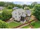 This backyard has a beautiful deck, a screened in porch, and a large grassy lawn at 435 Ruby Forest Pkwy, Suwanee, GA 30024