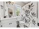 Bathroom featuring a white vanity, toilet, and decorative shower curtain with leafy pattern at 435 Ruby Forest Pkwy, Suwanee, GA 30024