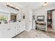 Spacious bathroom featuring dual sinks, vanity, and a door to a walk-in closet at 435 Ruby Forest Pkwy, Suwanee, GA 30024