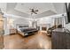 Spacious main bedroom with hardwood floors, fireplace, sitting area, and tray ceilings at 435 Ruby Forest Pkwy, Suwanee, GA 30024