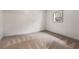 Minimalist bedroom with neutral tones, a small window, and soft carpet at 435 Ruby Forest Pkwy, Suwanee, GA 30024
