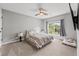 Bedroom featuring a ceiling fan, window with blinds, and carpeted floor at 435 Ruby Forest Pkwy, Suwanee, GA 30024