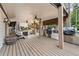 Spacious backyard deck features an outdoor kitchen, ceiling fans, and a lovely area for entertaining at 435 Ruby Forest Pkwy, Suwanee, GA 30024