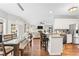 Open floor plan featuring a dining area with contemporary lighting, kitchen, and access to the outdoors at 435 Ruby Forest Pkwy, Suwanee, GA 30024